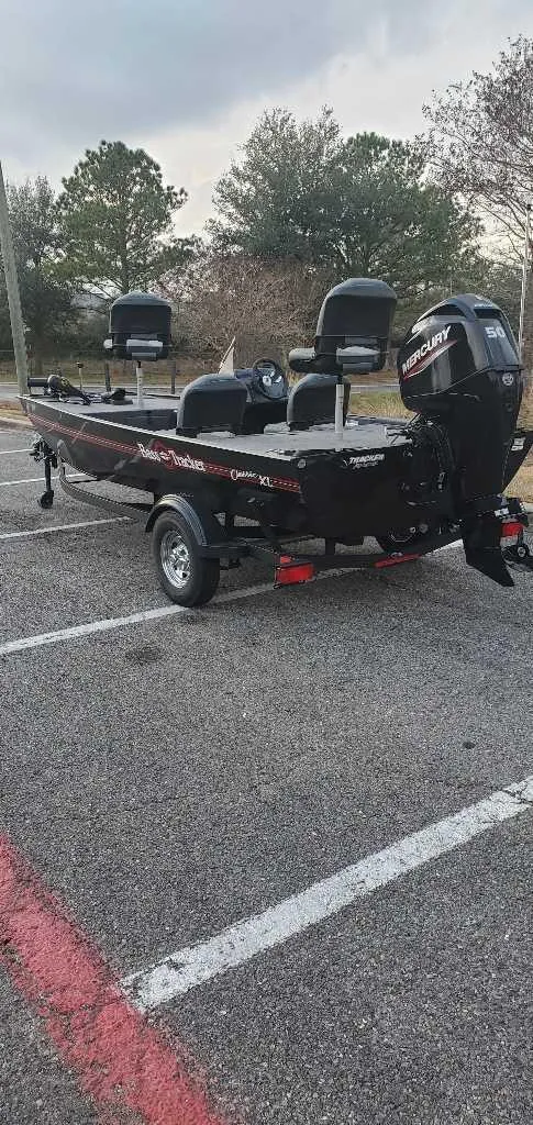 Slide: The Image of 2025 Tracker Bass Tracker Classic XL boat on trailer in parking lot. - 5