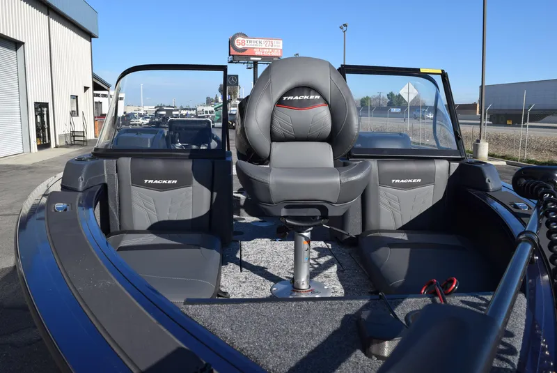 Slide: The Image of 2025 Tracker Targa V-19 Combo boat interior with seating and windshield. - 12