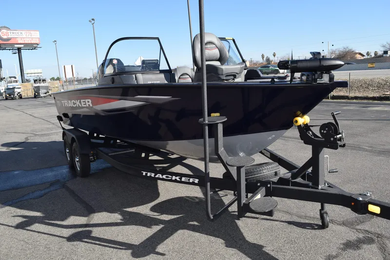 Slide: The Image of 2025 Tracker Targa V-19 Combo boat on trailer in parking lot. - 3