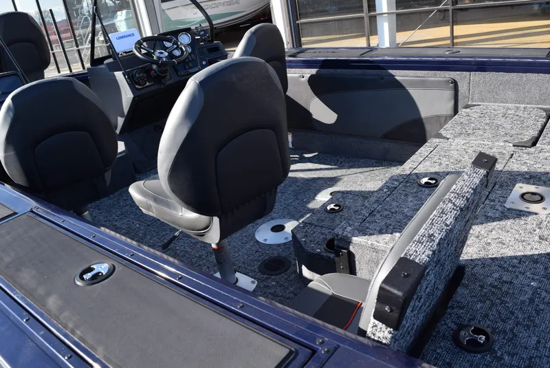 Slide: The Image of 2025 Tracker Targa V-19 Combo boat interior with seating and dashboard. - 6