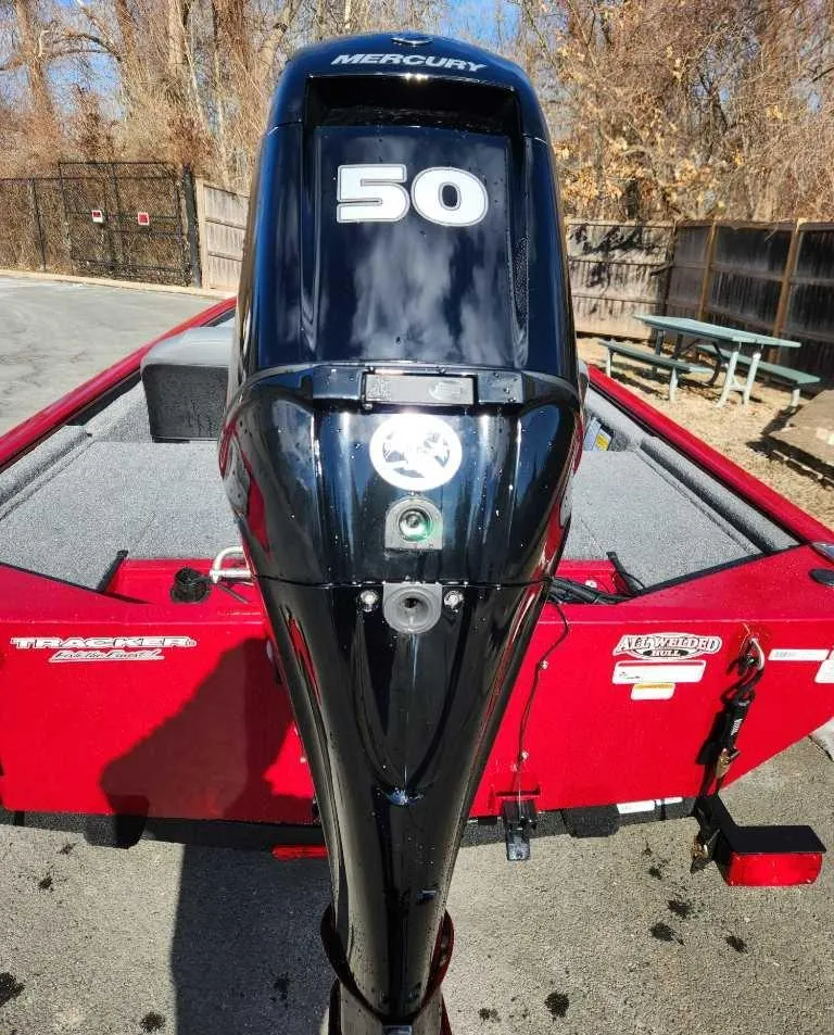 Slide: The Image of 2025 Tracker Pro 170 boat with Mercury 50 outboard motor, red exterior. - 2