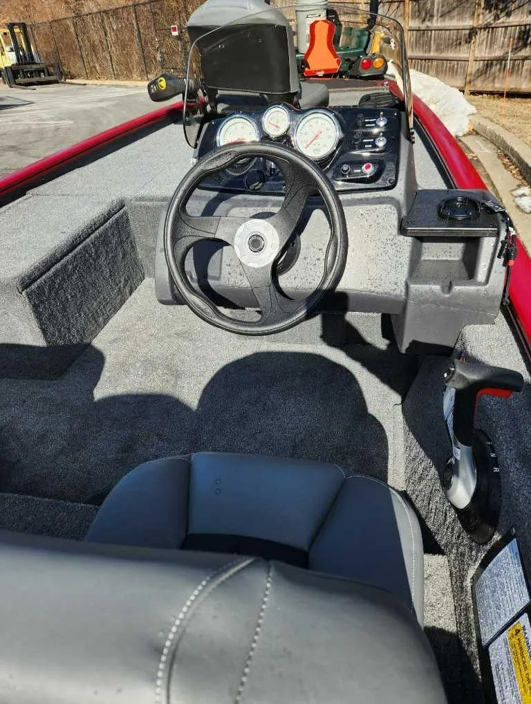 Slide: The Image of 2025 Tracker Pro 170 boat interior with steering wheel and dashboard controls. - 3