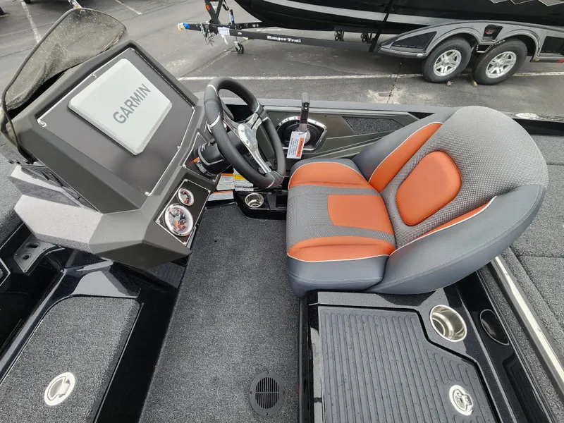 Slide: The Image of 2025 Ranger Z518 Cup-Equipped boat interior with Garmin display and ergonomic seating. - 2