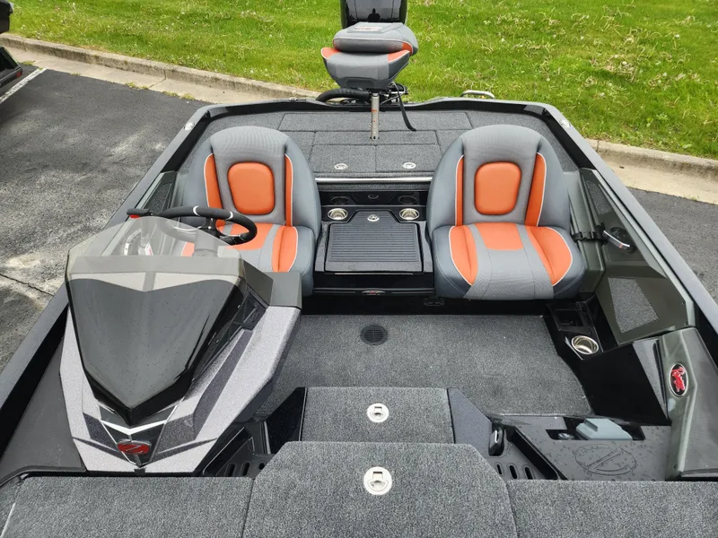 Slide: The Image of 2025 Ranger Z518 Cup-Equipped boat interior with gray and orange seating. - 3