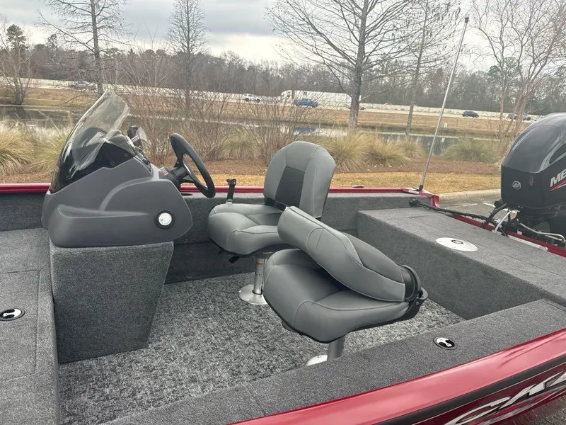 Slide: The Image of 2025 Tracker Super Guide V-16 SC boat interior with seating and steering console. - 5