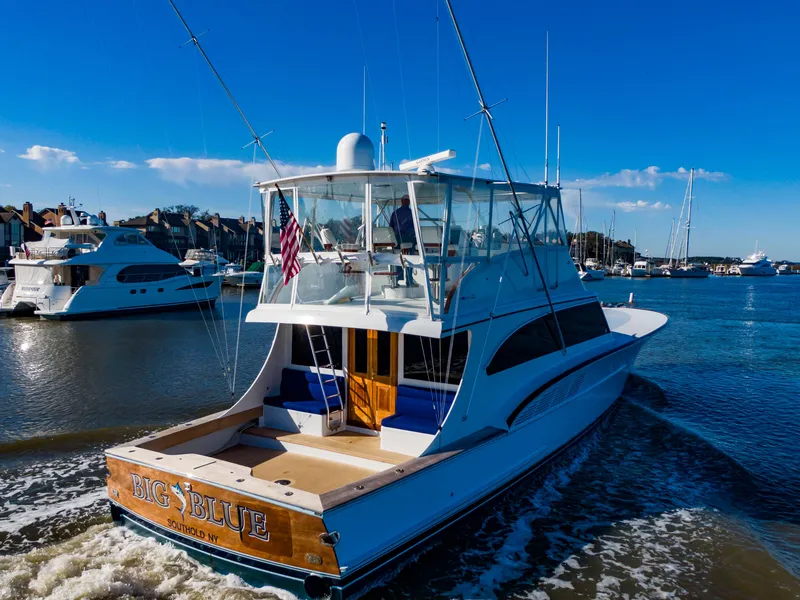 Slide: The Image of Custom Carolina 66 yacht, 2005 model, named "Big Blue" on the water. - 14