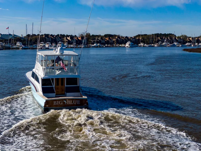 Slide: The Image of Custom Carolina 66 yacht "Big Blue" cruising in a marina, 2005 model. - 16