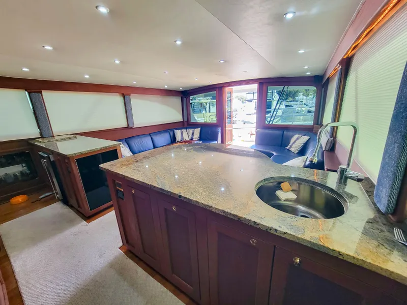 Slide: The Image of Luxurious interior of a 2005 Custom Carolina 66 yacht with modern kitchen and seating area. - 26