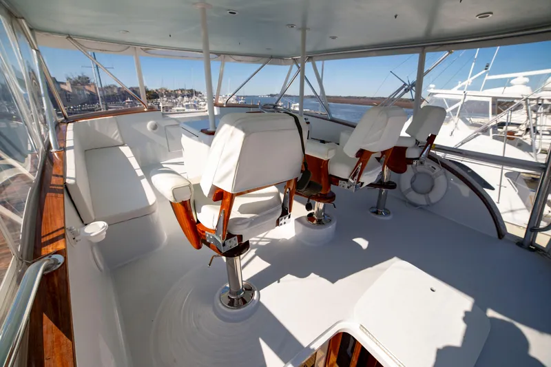 Slide: The Image of Custom Carolina 66 yacht interior, 2005 model, featuring luxurious seating and panoramic views. - 42