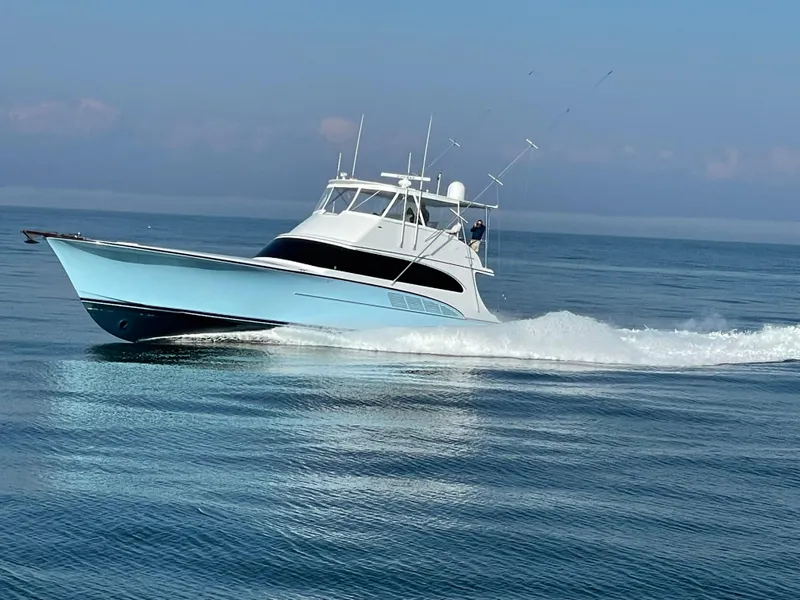 Slide: The Image of Custom Carolina 66 yacht cruising on calm waters, 2005 model. - 46