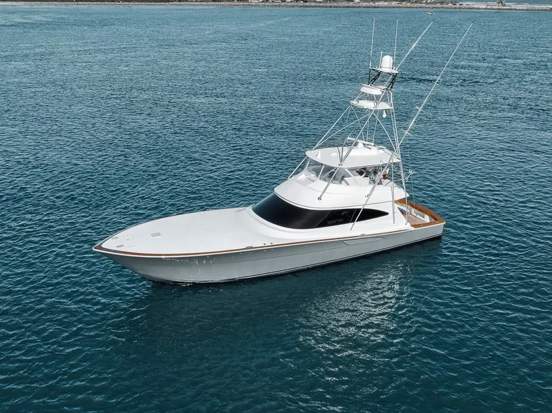 Slide: The Image of 2023 Viking 72 Convertible yacht on open water. - 10