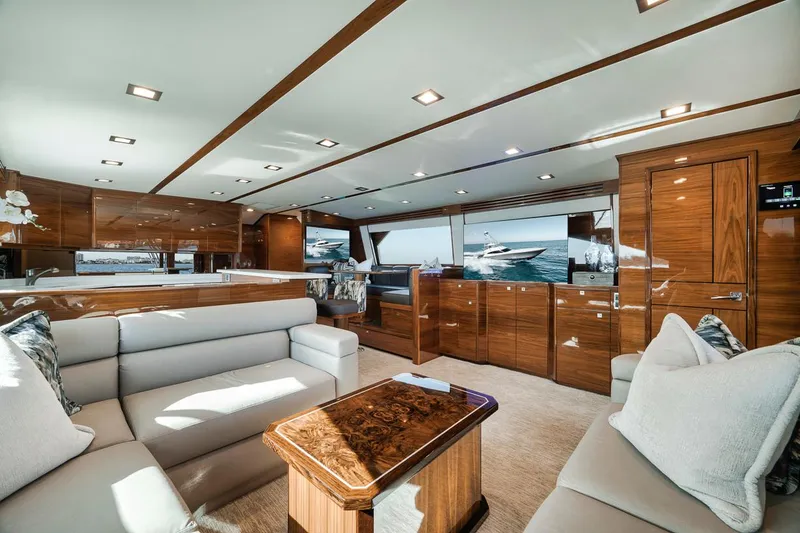 Slide: The Image of Luxurious interior of 2023 Viking 72 Convertible yacht with elegant wood finishes. - 24