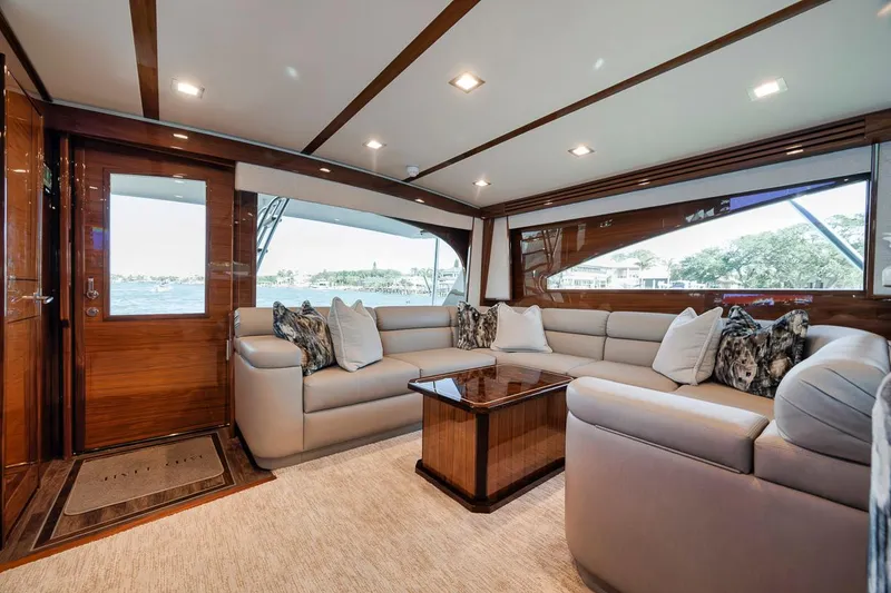Slide: The Image of Luxurious interior of 2023 Viking 72 Convertible yacht with plush seating and elegant decor. - 26