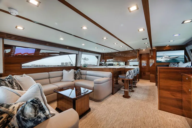 Slide: The Image of Luxurious interior of 2023 Viking 72 Convertible yacht with plush seating and elegant wood finishes. - 28