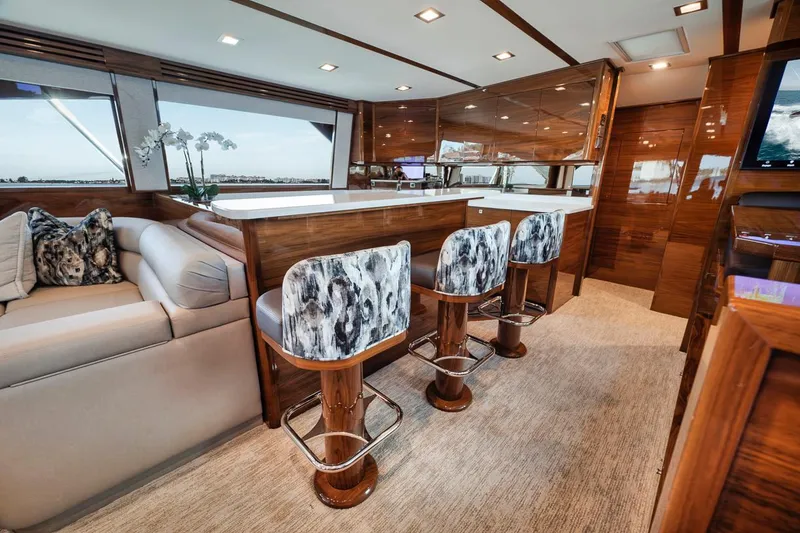 Slide: The Image of Luxurious interior of 2023 Viking 72 Convertible yacht with elegant seating and modern design. - 29