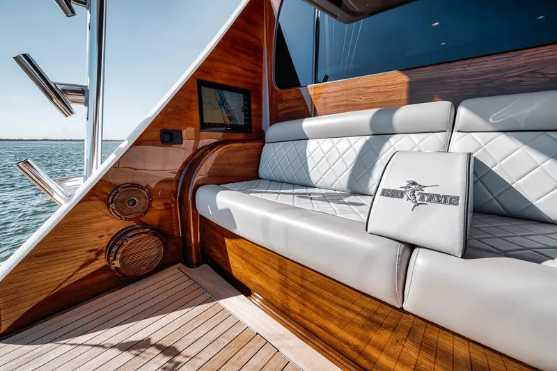 Slide: The Image of Luxurious seating area on 2023 Viking 72 Convertible yacht with elegant wood finish. - 3