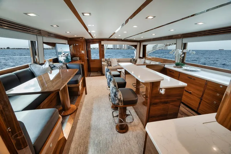 Slide: The Image of Luxurious interior of 2023 Viking 72 Convertible yacht with elegant seating and ocean view. - 30