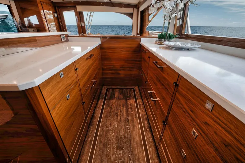 Slide: The Image of Luxurious interior of 2023 Viking 72 Convertible yacht with wooden cabinetry and ocean view. - 33