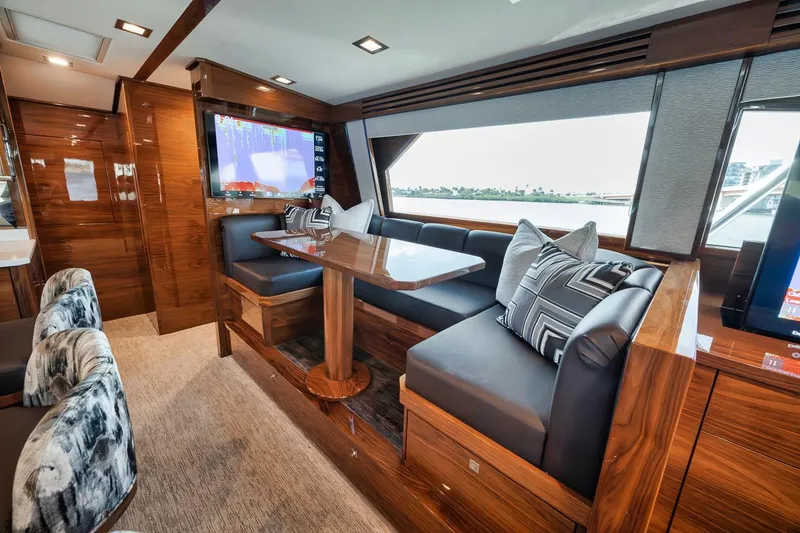 Slide: The Image of Luxurious interior of 2023 Viking 72 Convertible yacht with elegant seating and wooden finishes. - 36