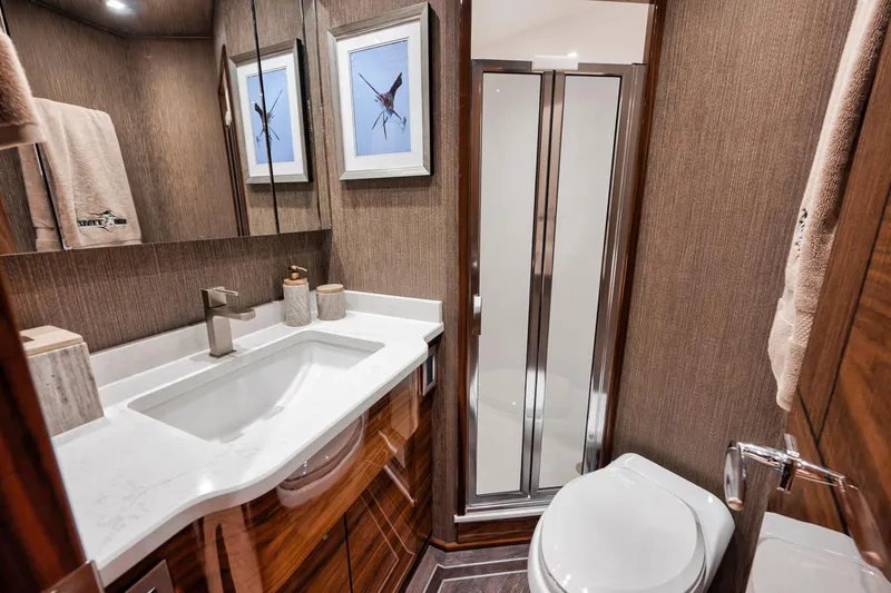 Slide: The Image of Luxurious bathroom in 2023 Viking 72 Convertible yacht with modern fixtures and elegant decor. - 46