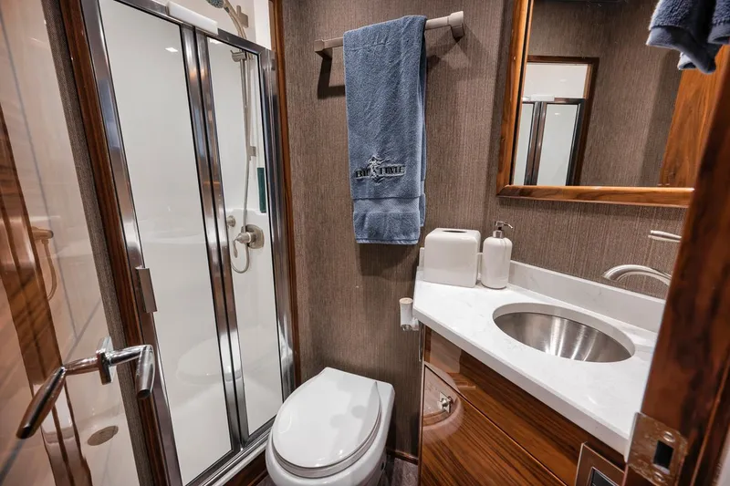 Slide: The Image of Luxury bathroom in 2023 Viking 72 Convertible yacht with modern fixtures and elegant design. - 49