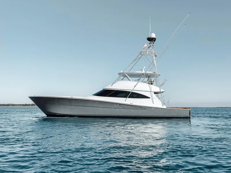 Slide: The Image of 2023 Viking 72 Convertible yacht on calm blue water. - 6