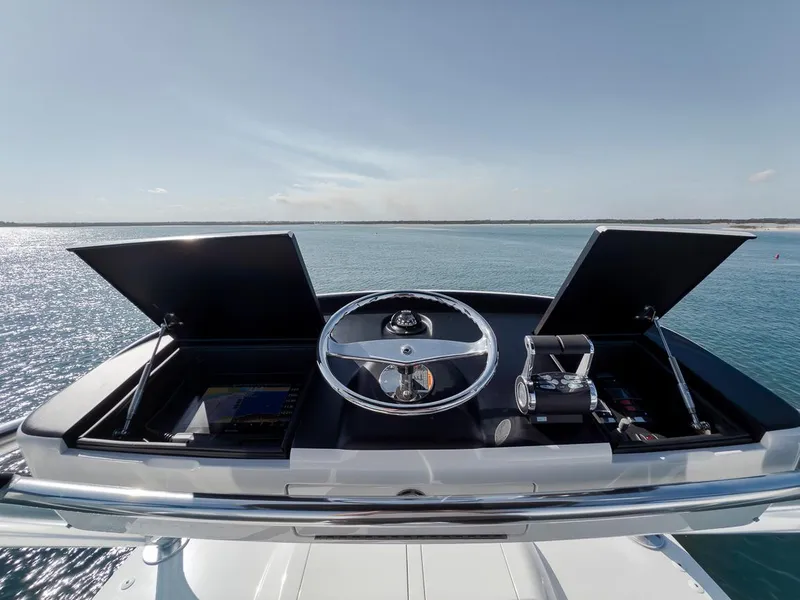 Slide: The Image of 2023 Viking 72 Convertible yacht helm with ocean view. - 76