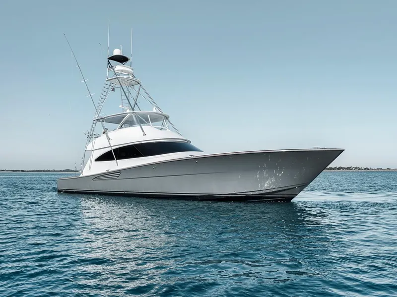 Slide: The Image of 2023 Viking 72 Convertible yacht on calm blue water. - 8