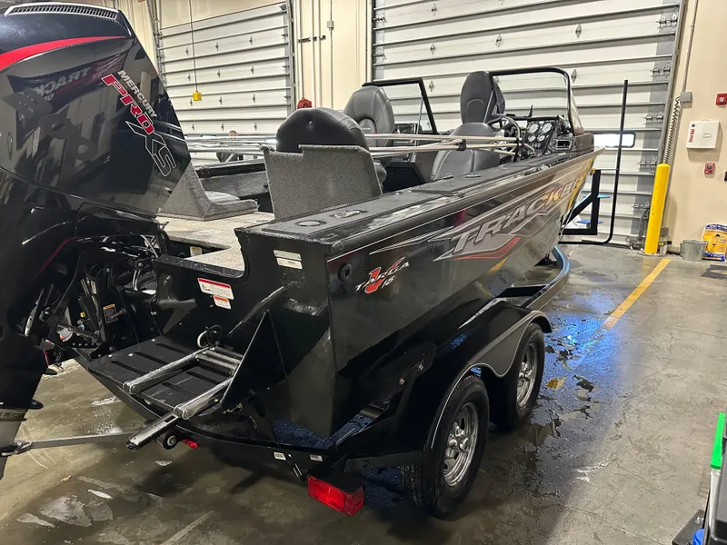 Slide: The Image of 2023 Tracker Targa V-18 WT boat in a garage, rear view. - 10