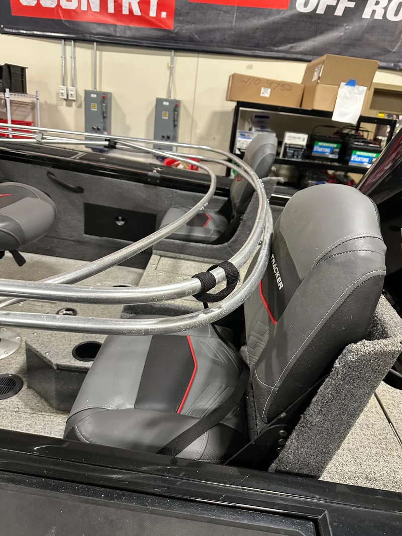 Slide: The Image of 2023 Tracker Targa V-18 WT boat interior with gray and red seating. - 7
