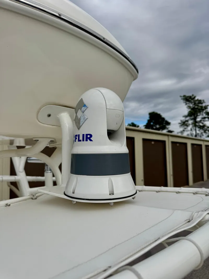 Slide: The Image of FLIR camera mounted on 2019 Pathfinder 2600 HPS boat under cloudy sky. - 15