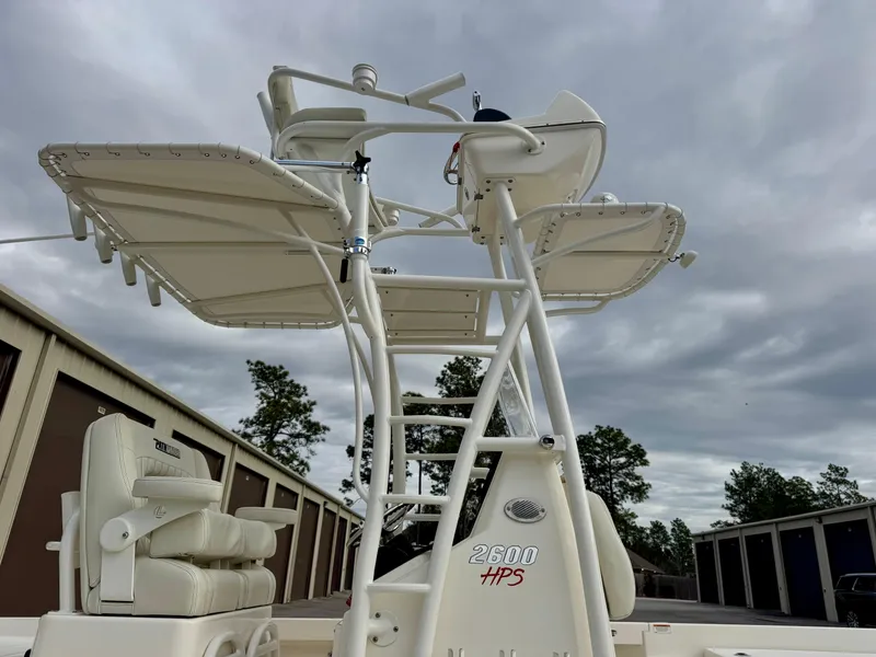 Slide: The Image of 2019 Pathfinder 2600 HPS boat with T-top under cloudy sky. - 16