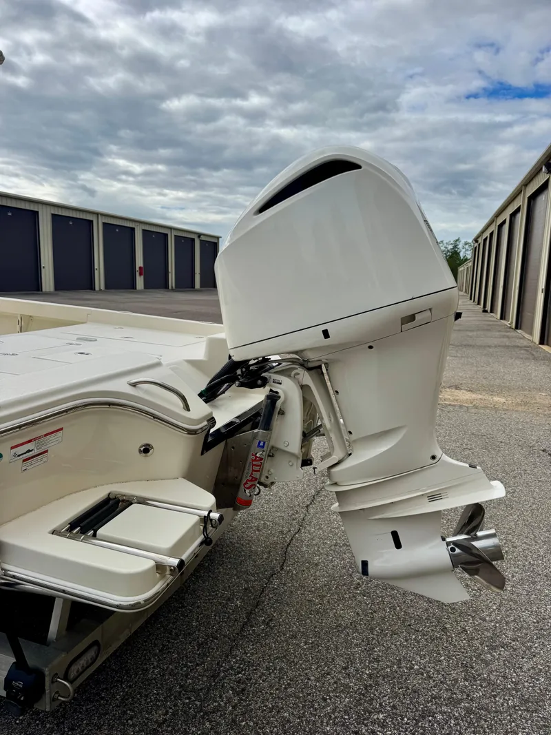 Slide: The Image of 2019 Pathfinder 2600 HPS boat engine, parked outdoors under cloudy skies. - 4