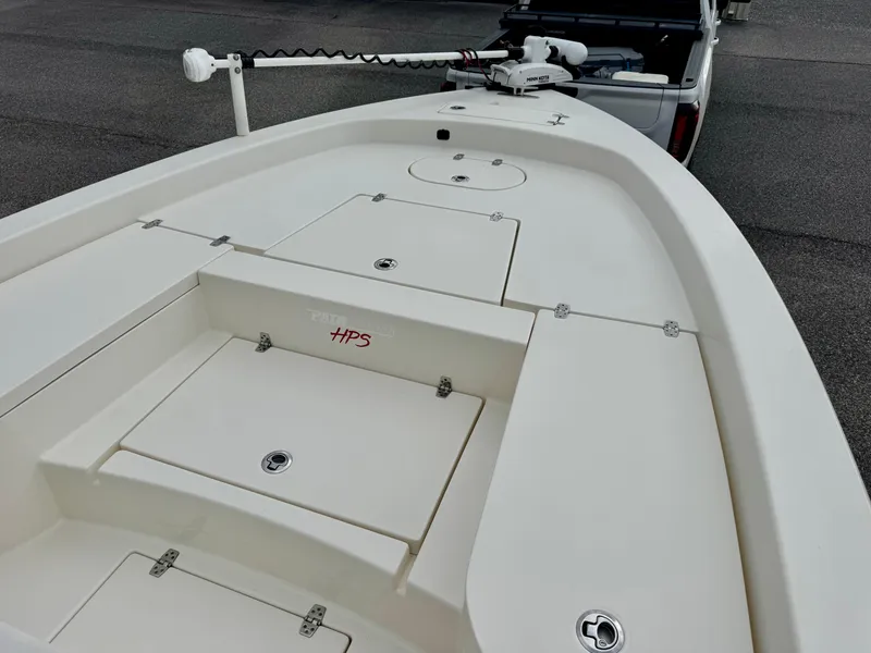 Slide: The Image of 2019 Pathfinder 2600 HPS boat deck with storage compartments and trolling motor. - 6