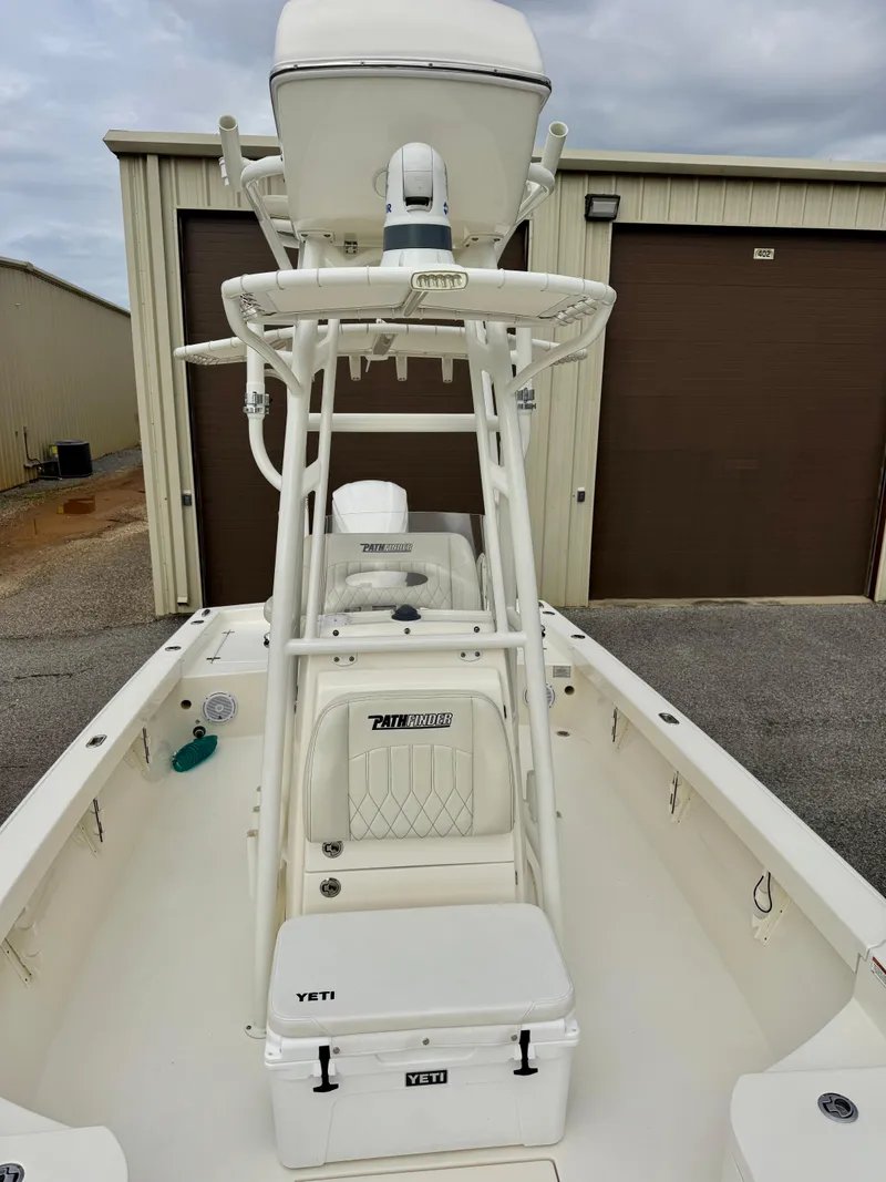 Slide: The Image of 2019 Pathfinder 2600 HPS boat with tower and Yeti cooler, parked outdoors. - 7