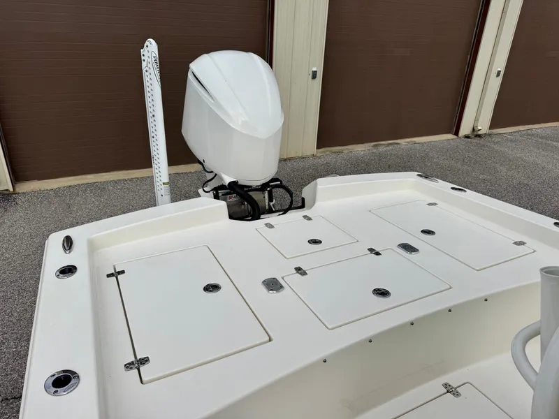 Slide: The Image of 2019 Pathfinder 2600 HPS boat with outboard motor in storage area. - 9