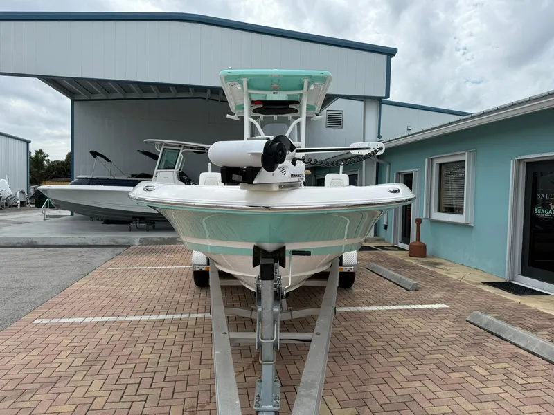 Slide: The Image of 2021 Caymas 26 HB boat on trailer in marina parking lot. - 4