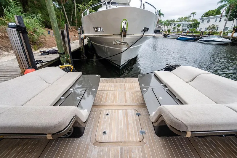 Slide: The Image of 2015 CNM 43 Continental yacht docked with luxurious seating area. - 13