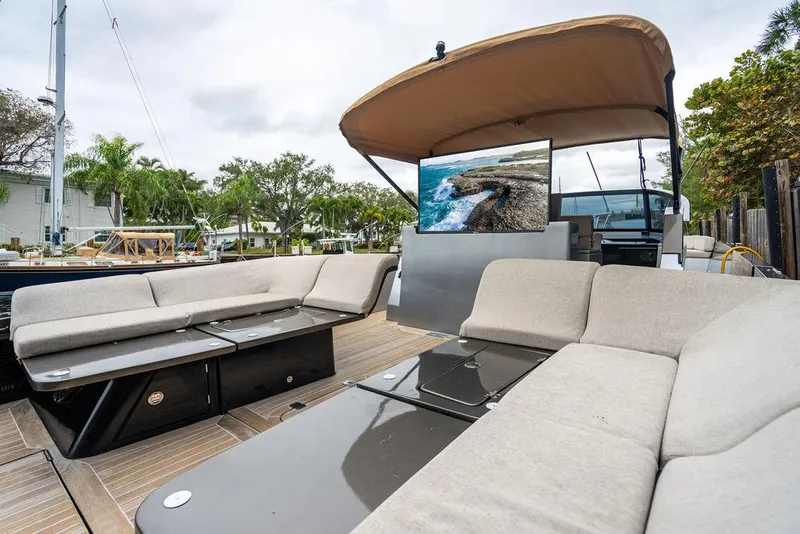 Slide: The Image of Luxurious 2015 CNM 43 Continental yacht with spacious outdoor seating and modern amenities. - 16