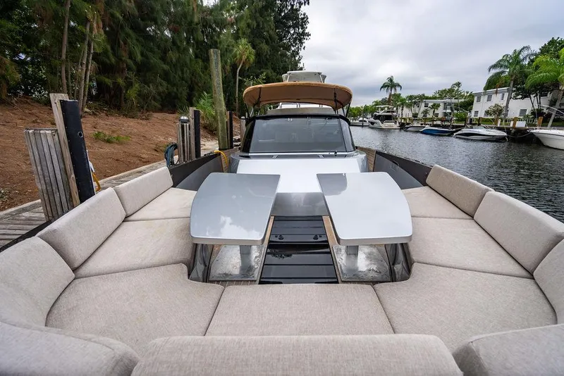 Slide: The Image of Luxury CNM 43 Continental yacht, 2015 model, docked with spacious seating area. - 20