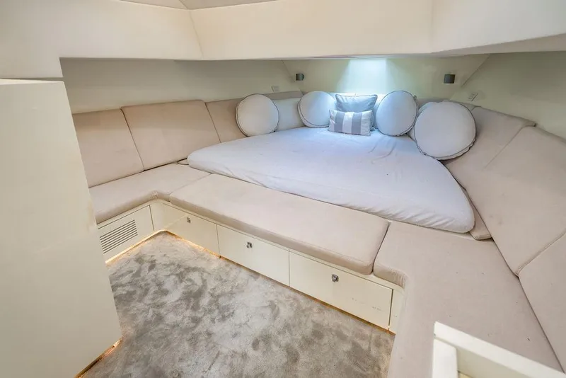 Slide: The Image of Luxurious interior of 2015 CNM 43 Continental yacht with plush seating and elegant bedding. - 21