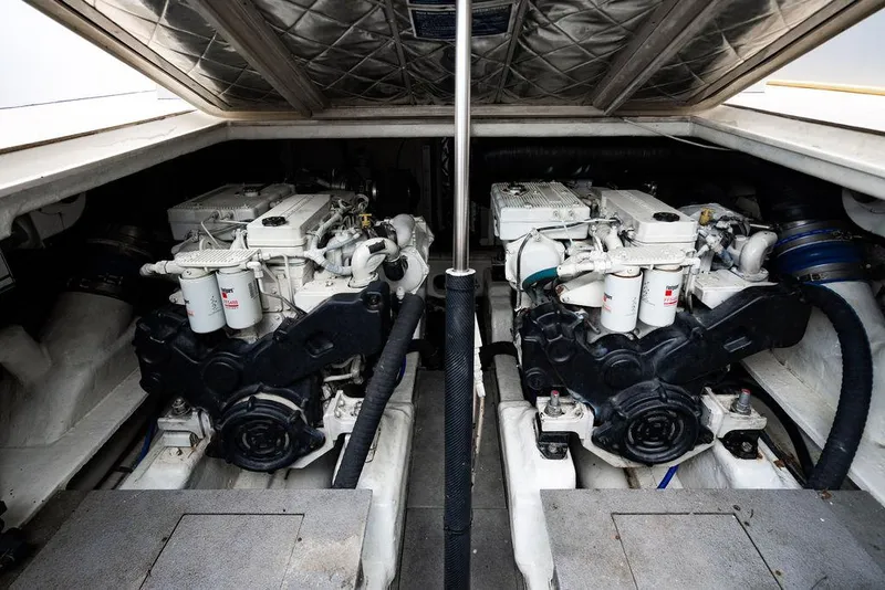 Slide: The Image of Engine compartment of 2015 CNM 43 Continental yacht, featuring dual engines. - 24