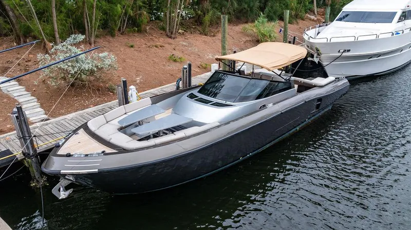 Slide: The Image of 2015 CNM 43 Continental luxury yacht docked by a wooden pier. - 3