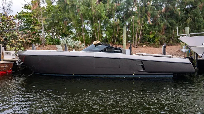 Slide: The Image of 2015 CNM 43 Continental yacht docked by lush greenery. - 5