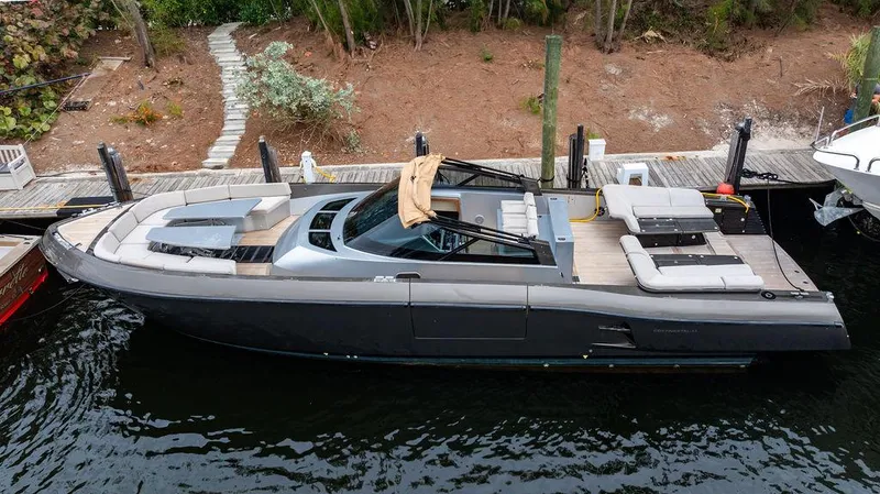 Slide: The Image of Luxury CNM 43 Continental yacht docked, 2015 model, sleek design, spacious deck. - 6