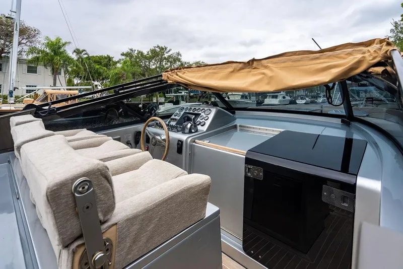 Slide: The Image of Luxury CNM 43 Continental yacht cockpit, 2015 model, featuring plush seating and sleek controls. - 9