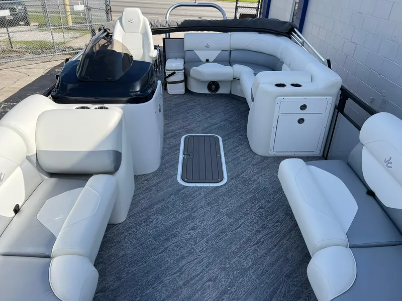 Slide: The Image of 2025 JC 201 Spirit TT Sport boat interior with white seating and modern design. - 3