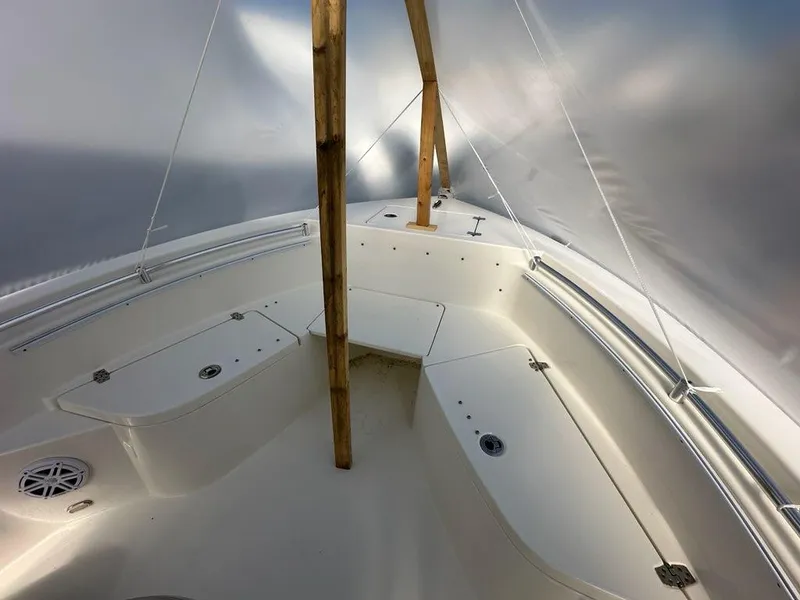 Slide: The Image of 2023 Cobia 220 Center Console boat interior under protective cover. - 10