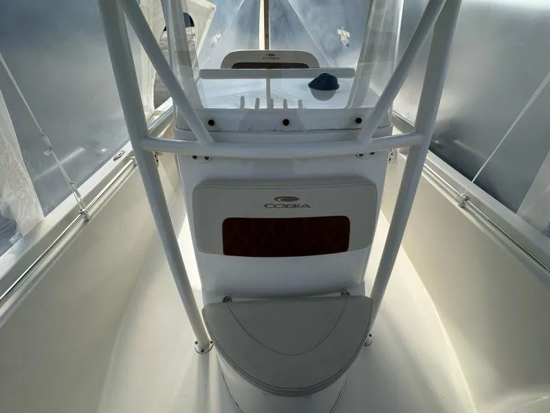 Slide: The Image of 2023 Cobia 220 Center Console boat interior with sleek design and modern features. - 11