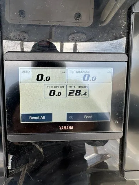 Slide: The Image of Yamaha display on 2023 Cobia 220 Center Console showing trip and total hours. - 4